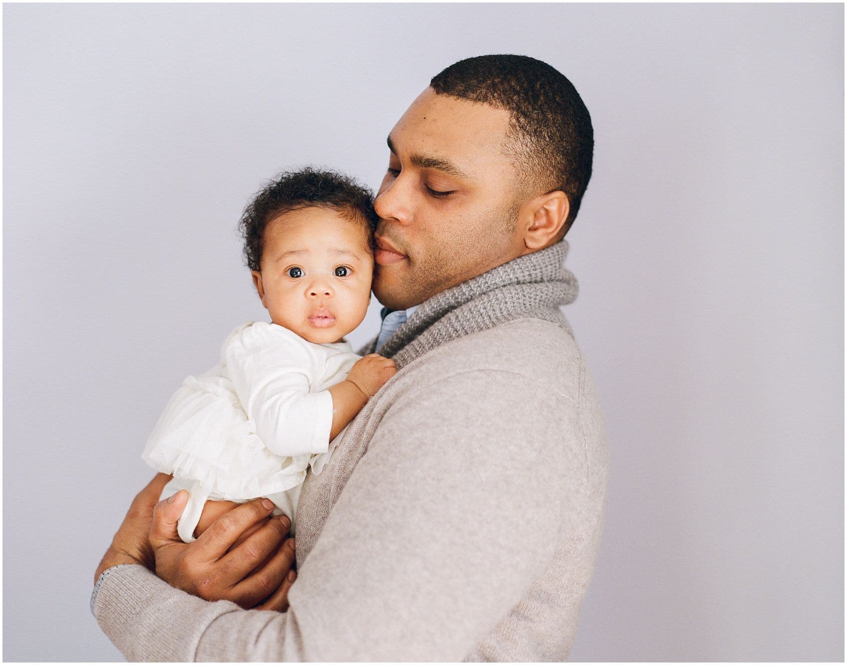 Daddy with baby girl at home
