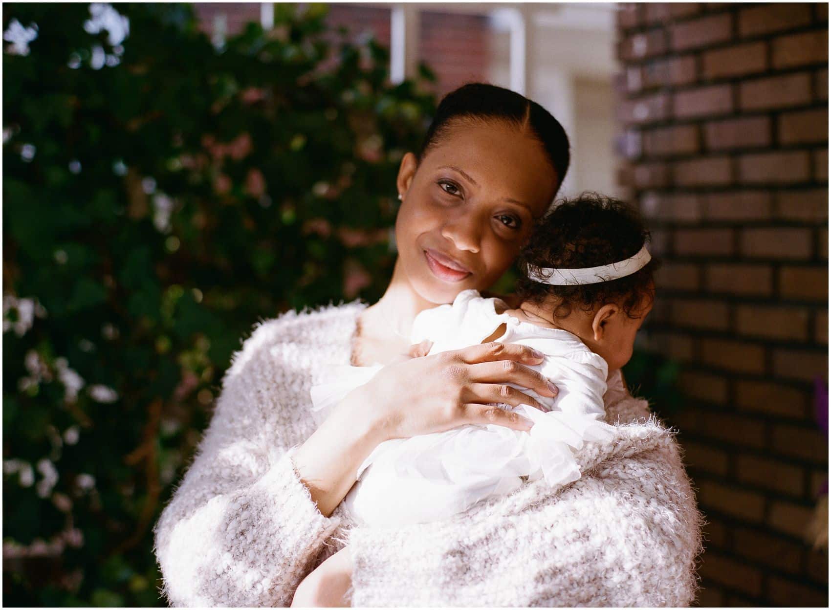 motherhood photos outside home in the sunlight of NY