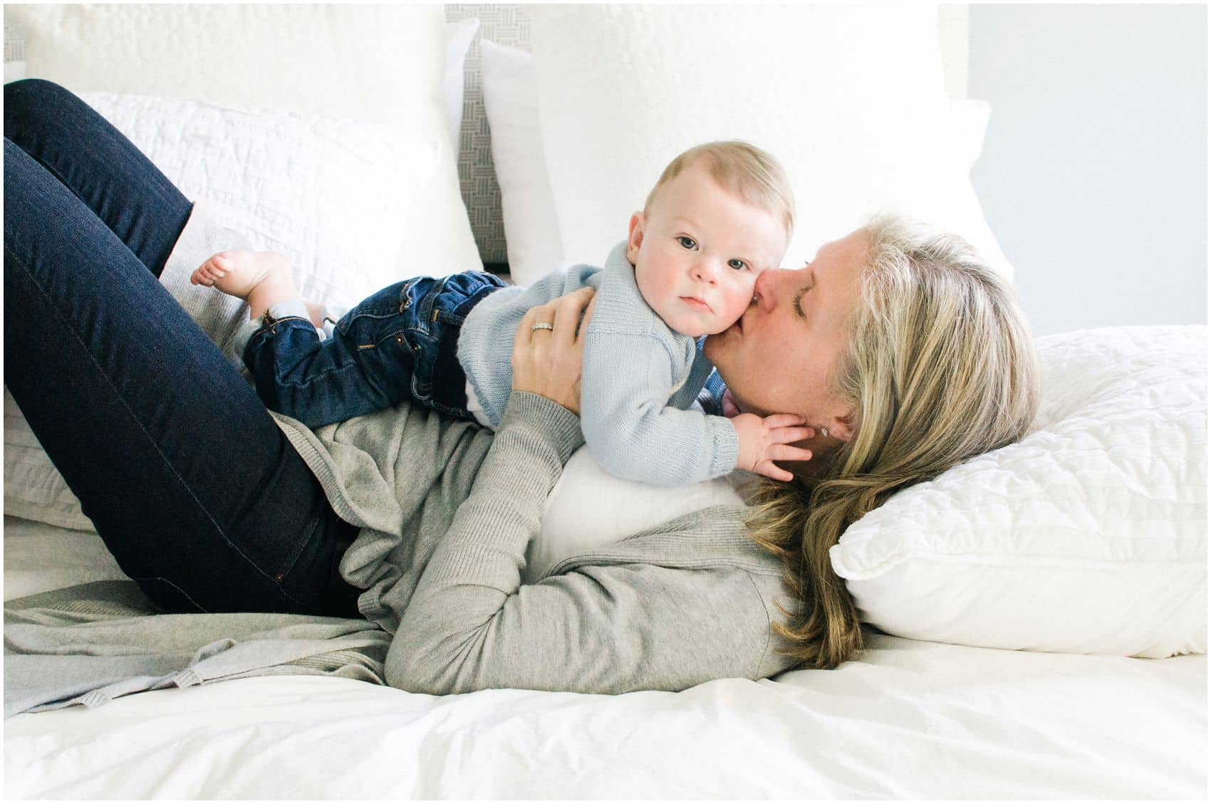 mommy kissing her baby boy for a portrait