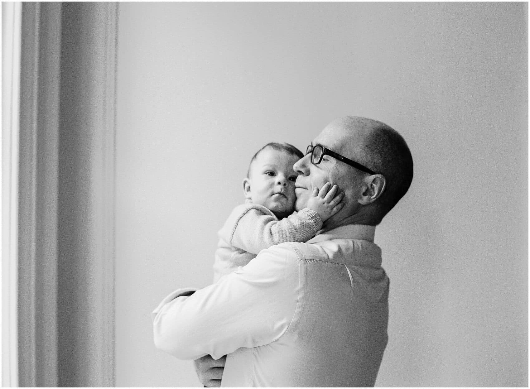 father and the baby hugging lifestyle portrait
