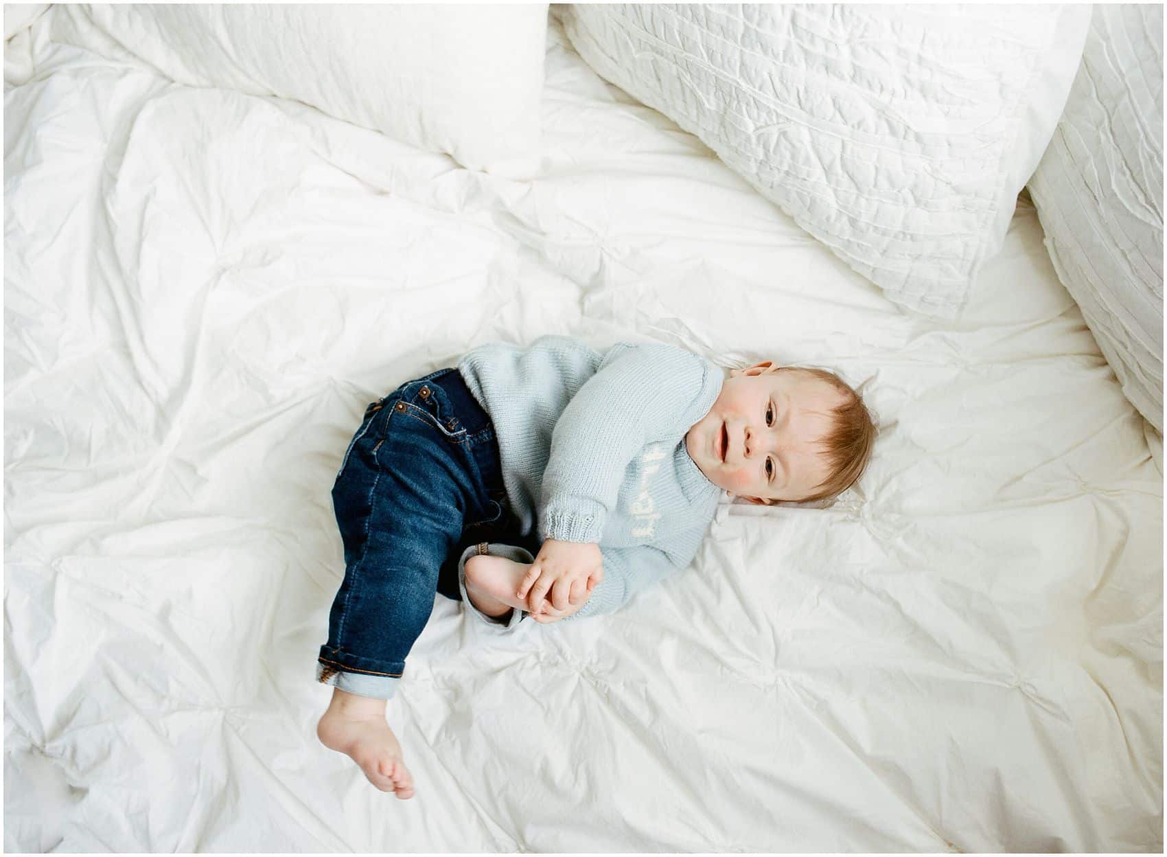 baby boy on the bed during the photo session