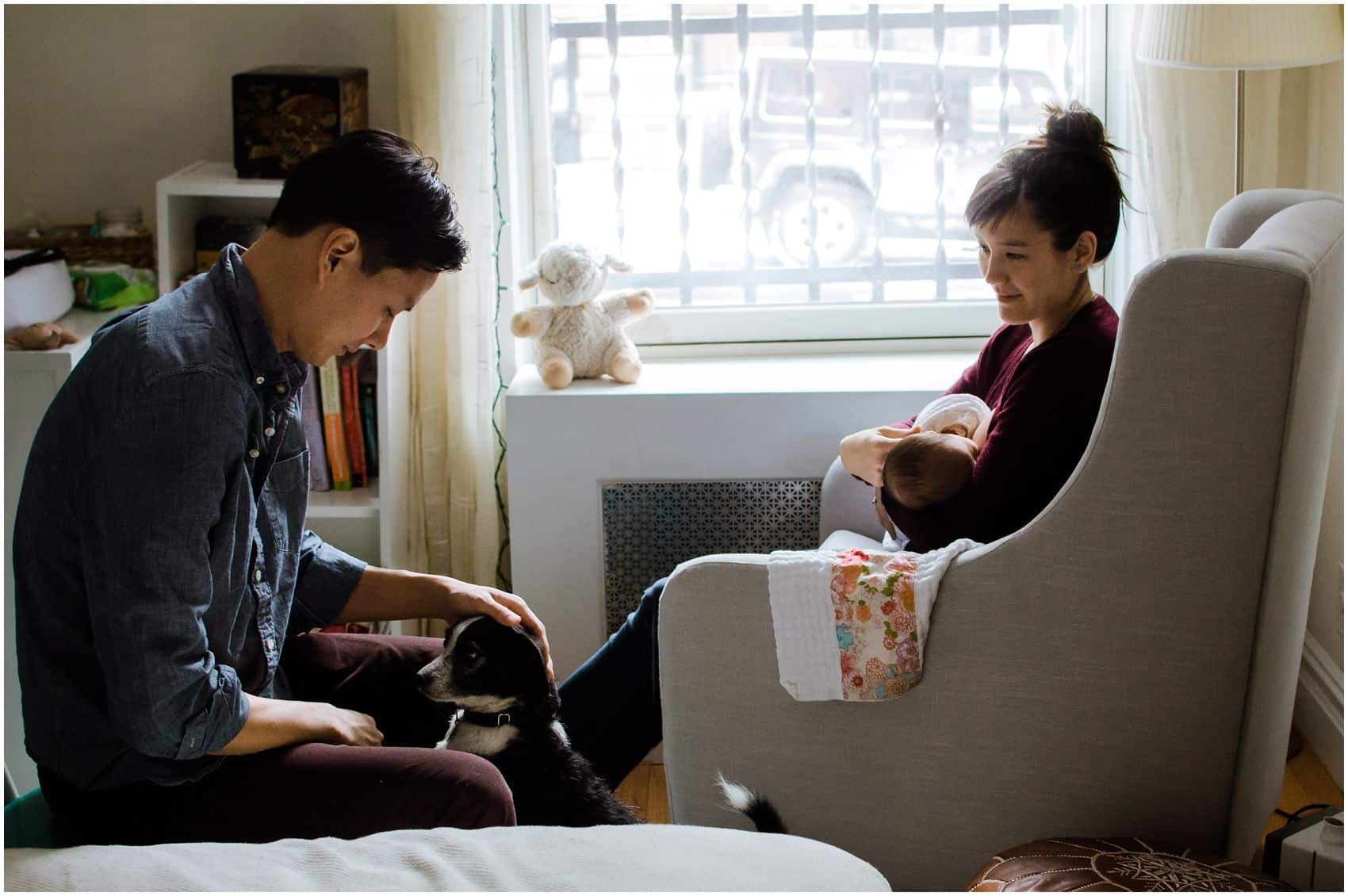 Best time to do newborn photography is around 3 weeks newborn in a family portrait with dog and mom nursing the new baby