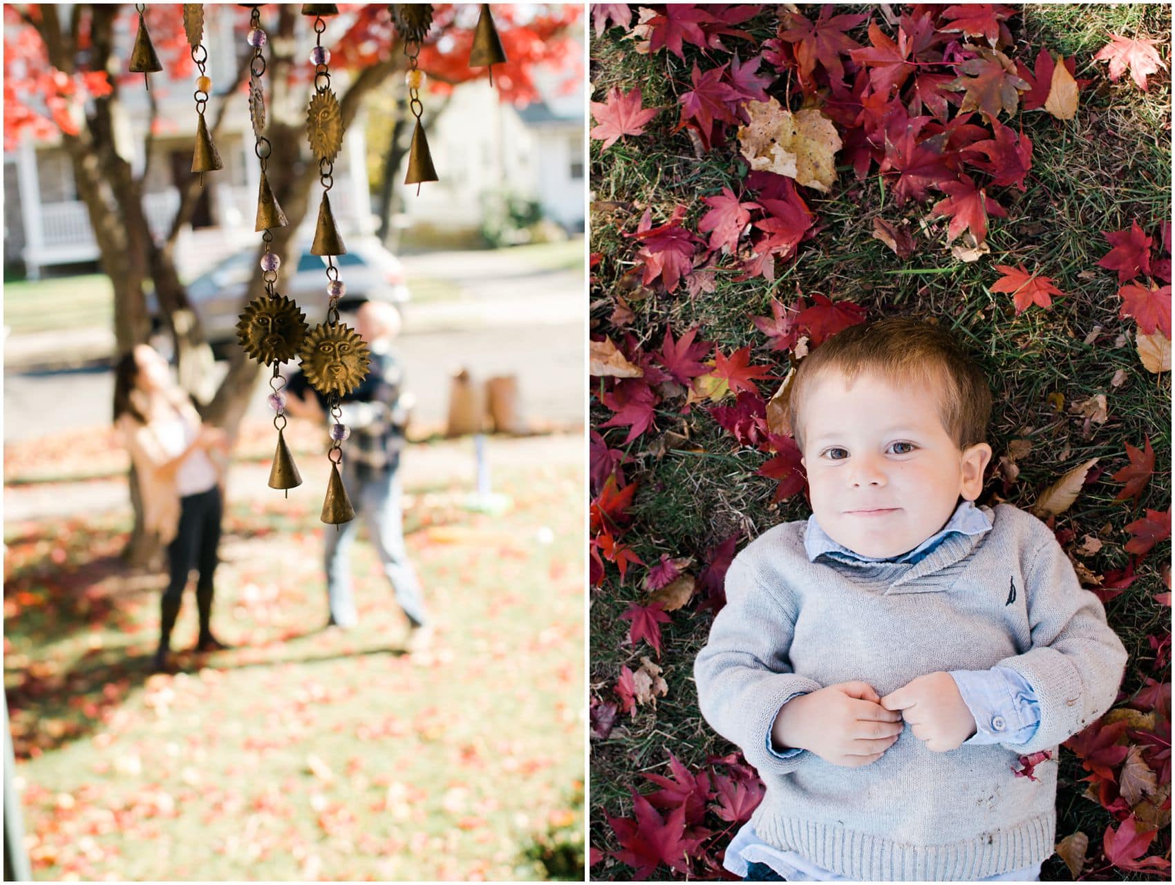 NYC portrait of a little boy in grey sweater laying on the ground with fall red leaves
