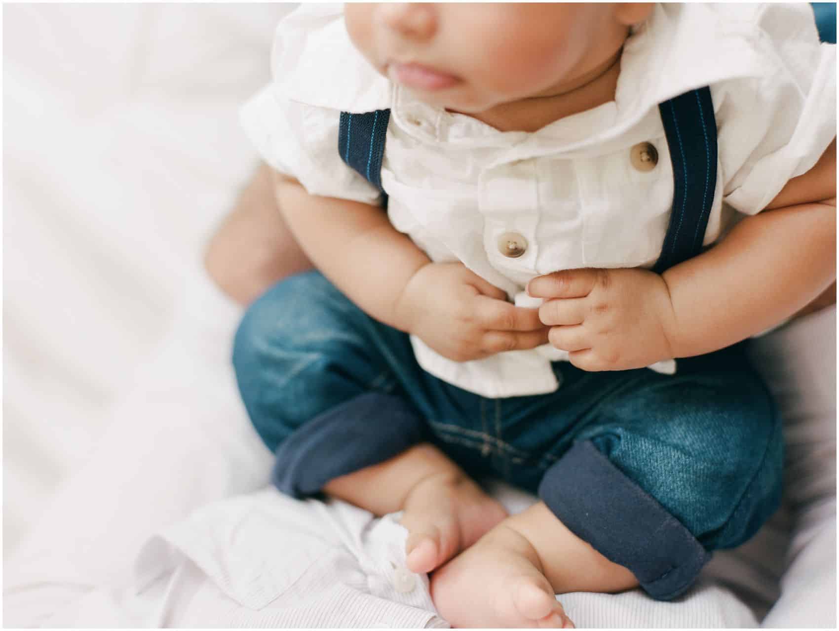 newborn photography NYC with puffy hands and feet of a baby boy
