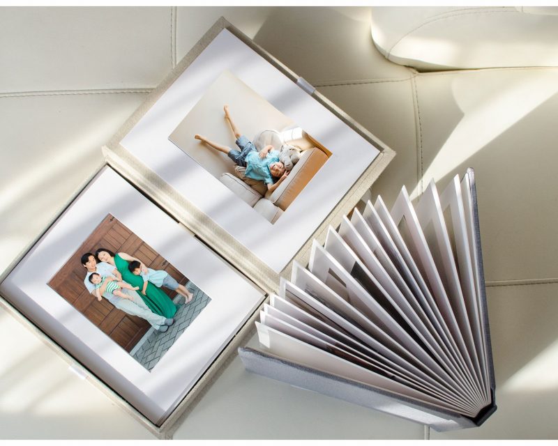 Fine art prints of a young family with two kids wearing neutral and green, captured in a family photography NYC session