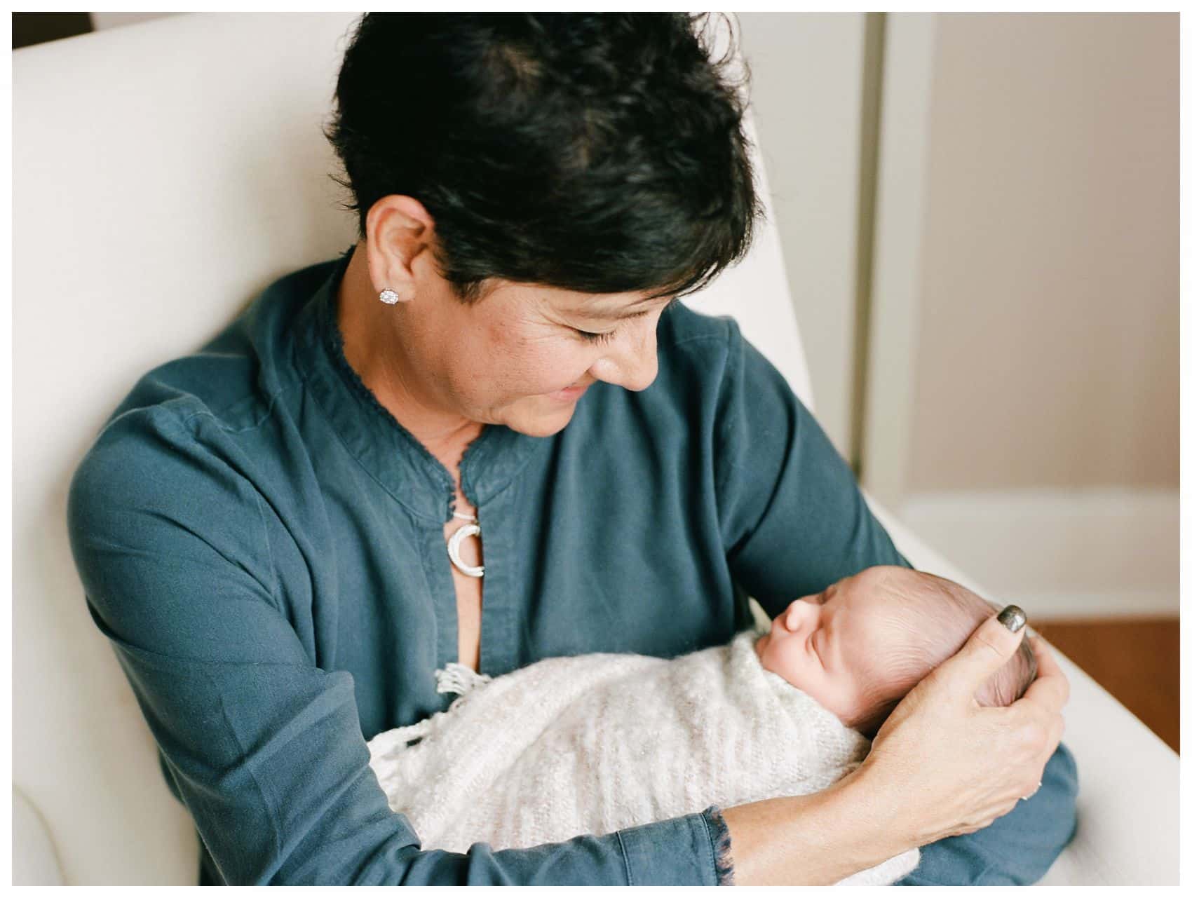 NYC Newborn Photographer Miriam Dubinsky shares best gift ideas for Mothers day with a photo of a grandmother holding her granddaughter