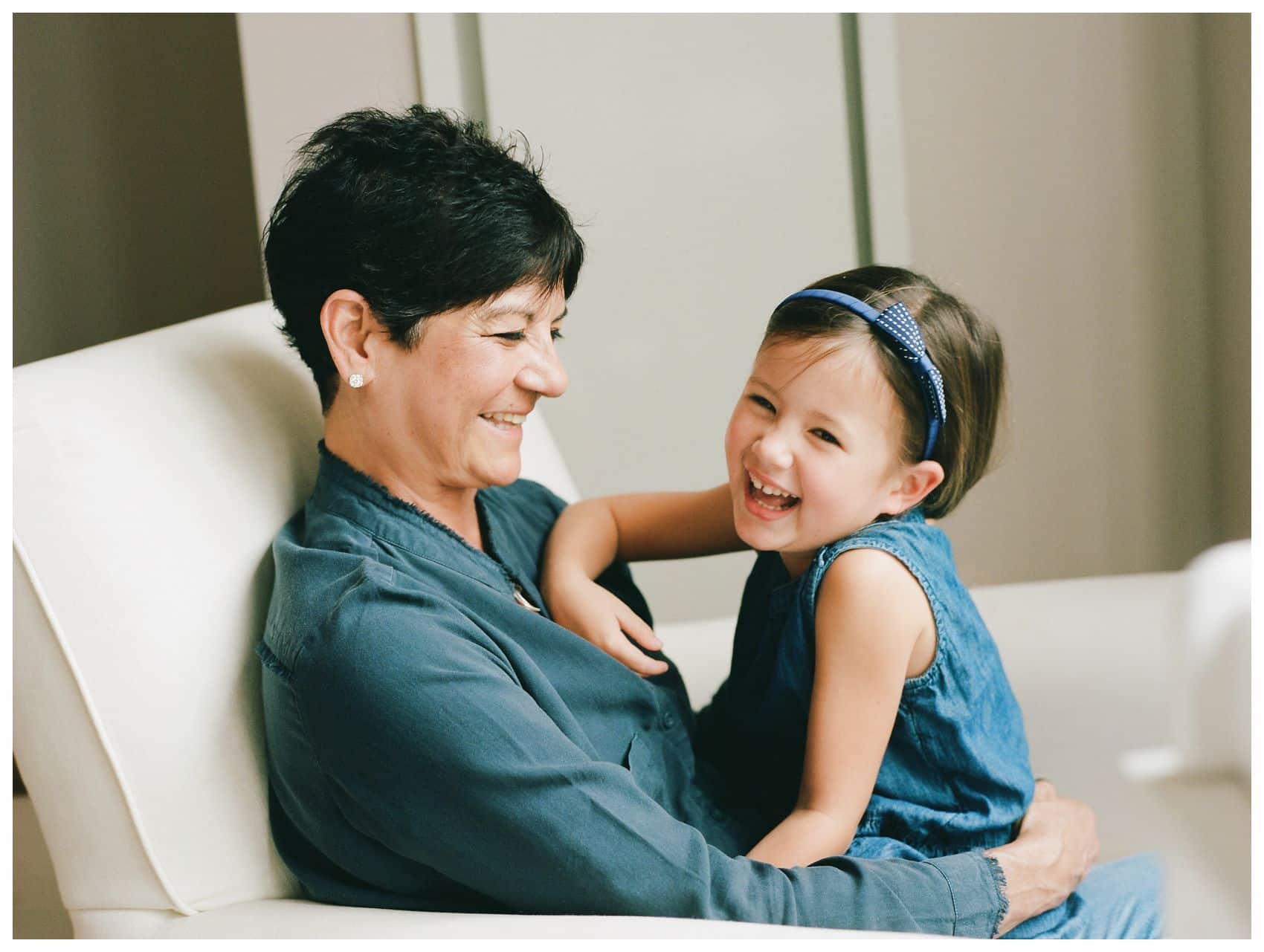 best family photography of a fun grandmother and little granddaughter sharing a laugh