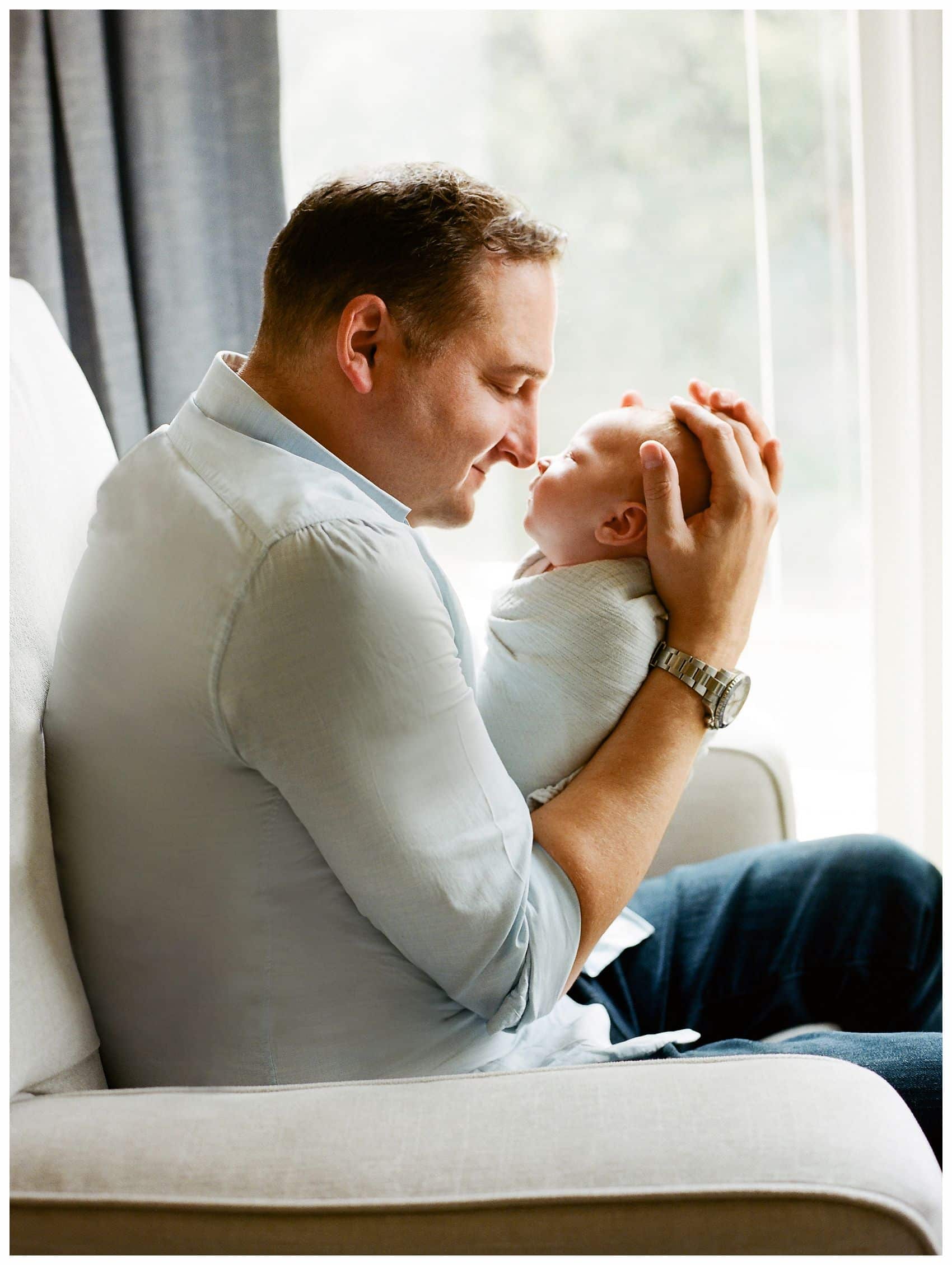 father and son bonding in best newborn photography NYC