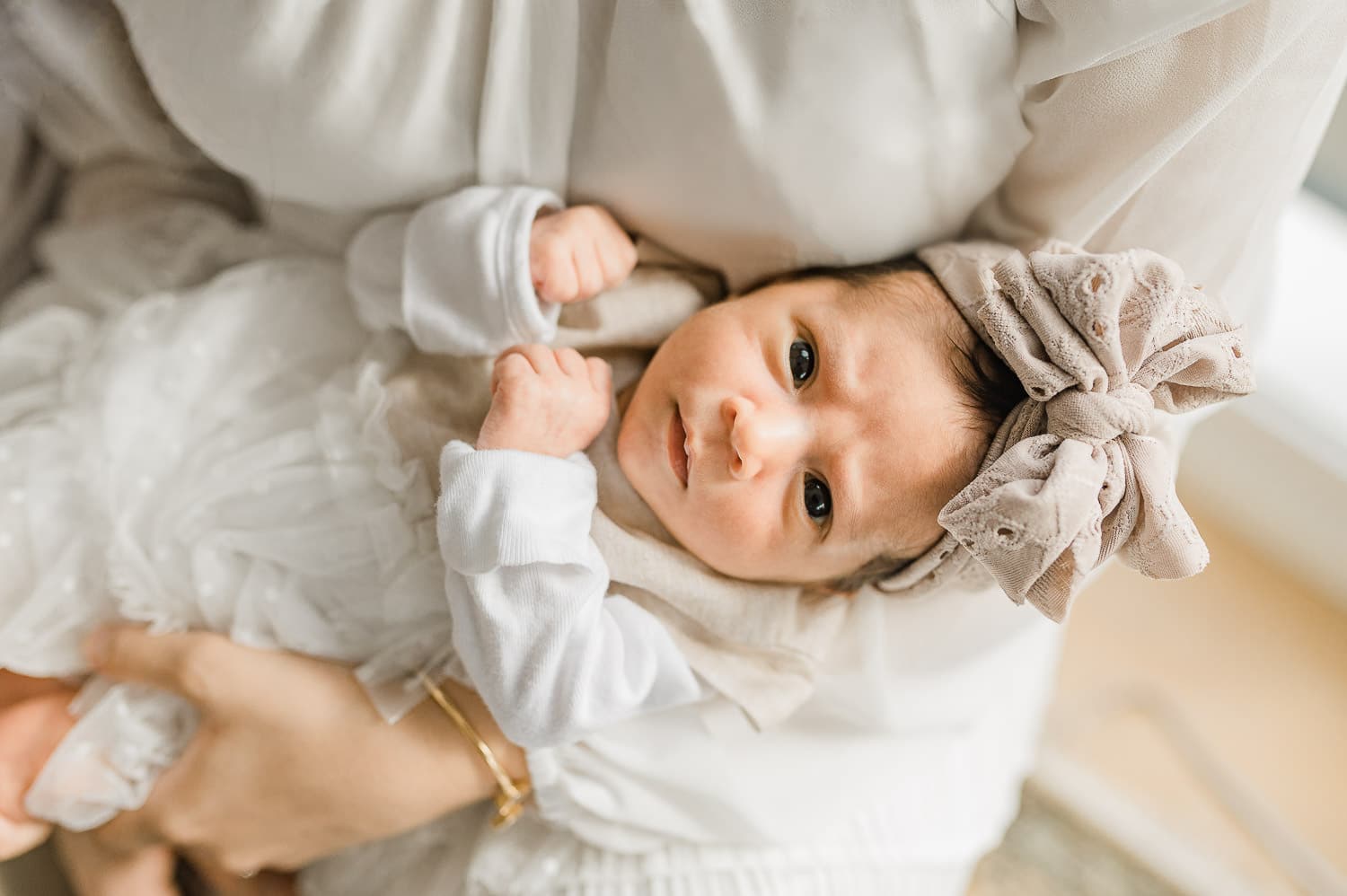 Awake baby girl at home in Manhattan during a photo session